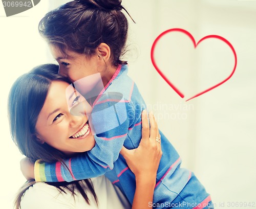 Image of hugging mother and daughter