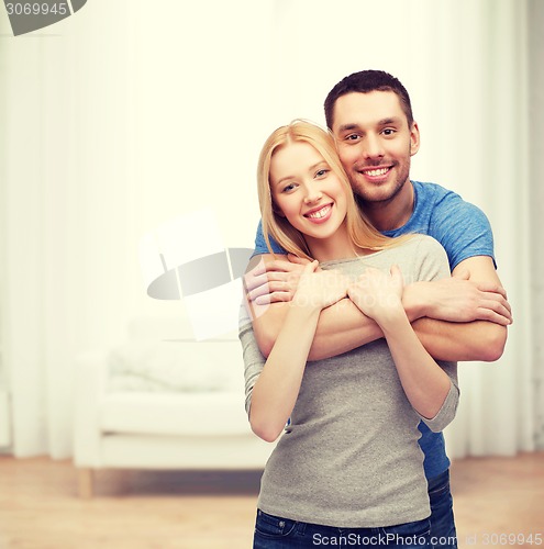 Image of smiling couple hugging