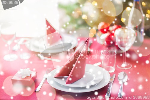 Image of room with christmas tree and decorated table