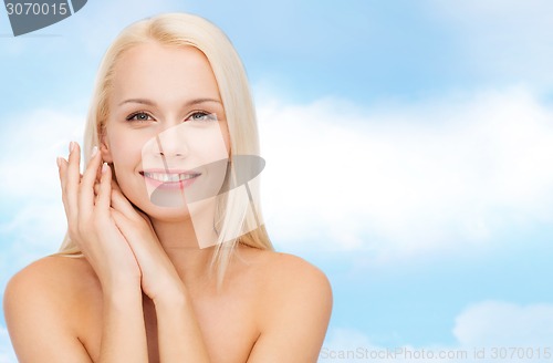 Image of face and hands of happy woman
