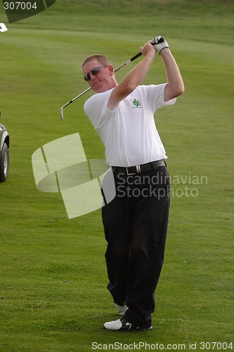 Image of Male golfer playing golf