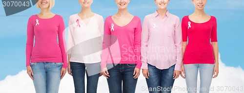 Image of close up of women with cancer awareness ribbons