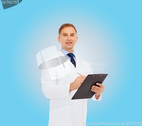 Image of smiling male doctor with clipboard