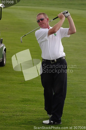 Image of Male golfer playing golf