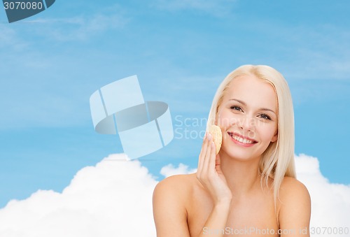 Image of beautiful woman with sponge