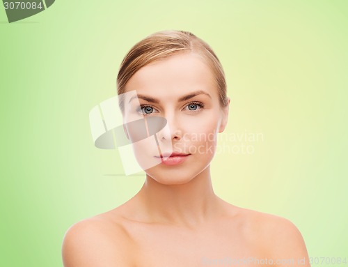 Image of beautiful young woman with bare shoulders