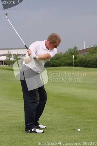 Image of Male golfer playing golf