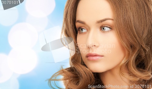 Image of beautiful young woman with bare shoulders