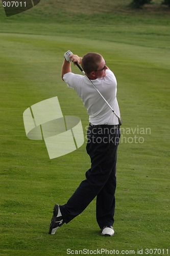 Image of Male golfer playing golf