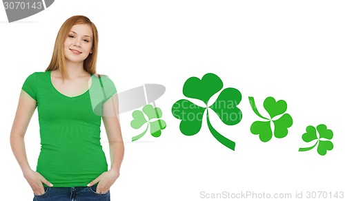 Image of smiling teen girl in green t-shirt with shamrock