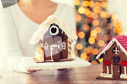 Image of close up of woman showing gingerbread house