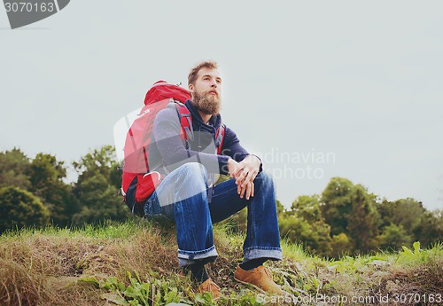 Image of man with backpack hiking