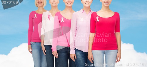 Image of close up of women with cancer awareness ribbons