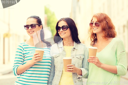 Image of smiling teenage girls with on street