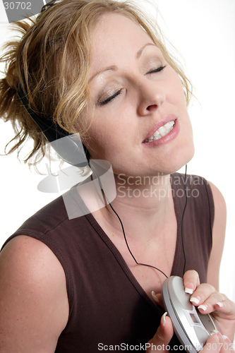 Image of Happy woman listening to music