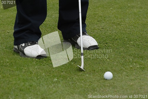 Image of Male golfer playing golf