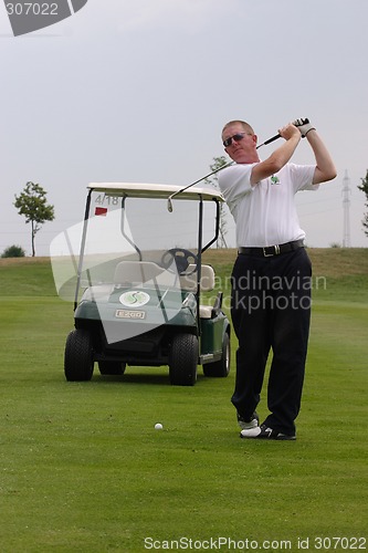 Image of Male golfer playing golf