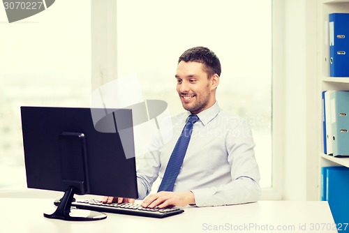 Image of smiling businessman or student with computer