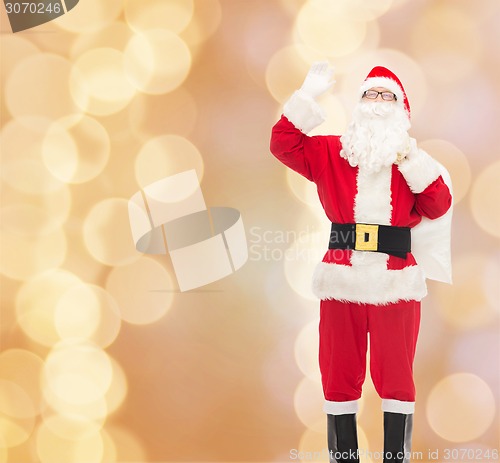 Image of man in costume of santa claus with bag
