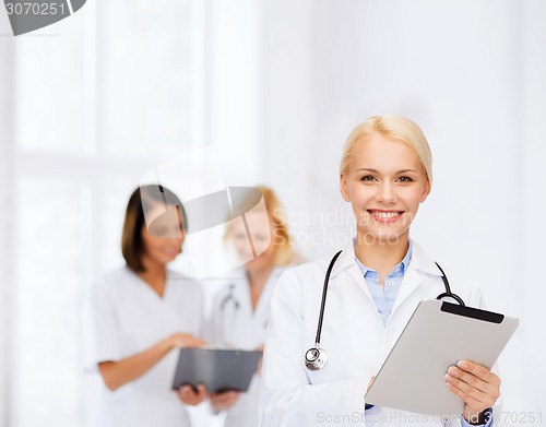 Image of female doctor with stethoscope and tablet pc