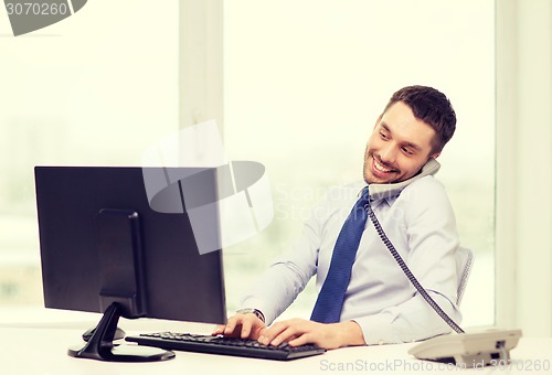 Image of smiling businessman or student with computer