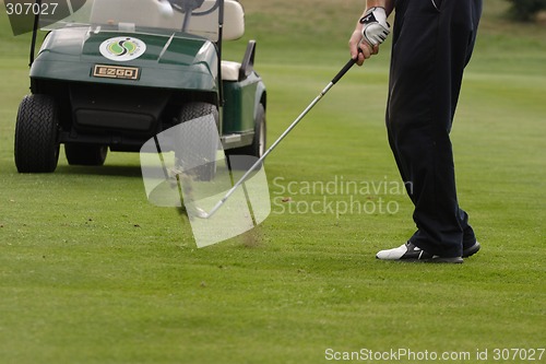 Image of Male golfer playing golf