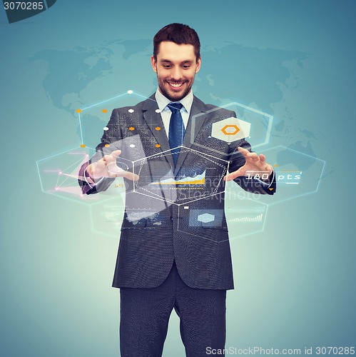 Image of businessman working with virtual screen