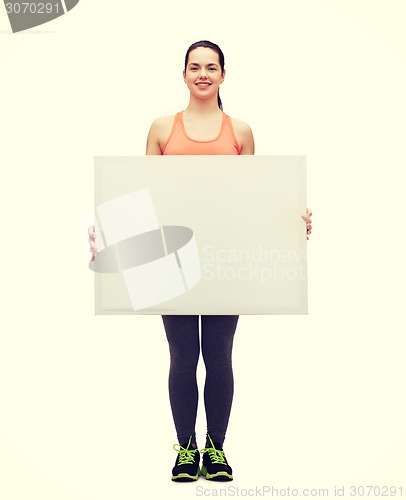 Image of teenage girl in sportswear with white board