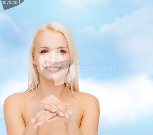 Image of face and hands of beautiful woman