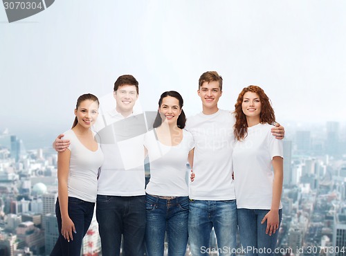 Image of group of smiling teenagers in white blank t-shirts