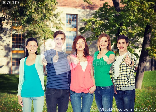 Image of group of smiling students showing thumbs up