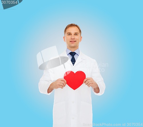 Image of smiling male doctor with red heart