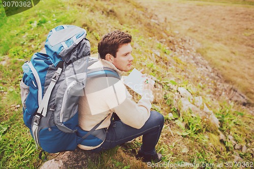 Image of man with backpack hiking