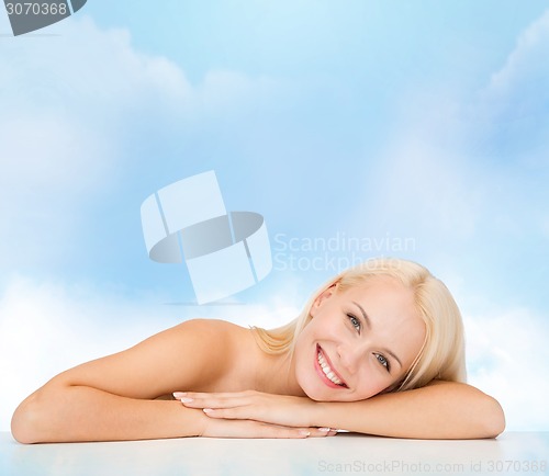 Image of clean face and shoulders of beautiful young woman