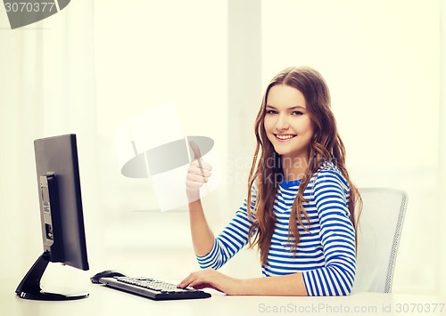 Image of dreaming teenage girl with computer at home