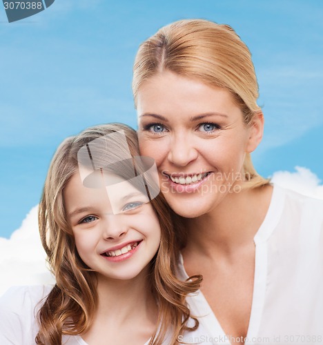 Image of smiling mother and little girl