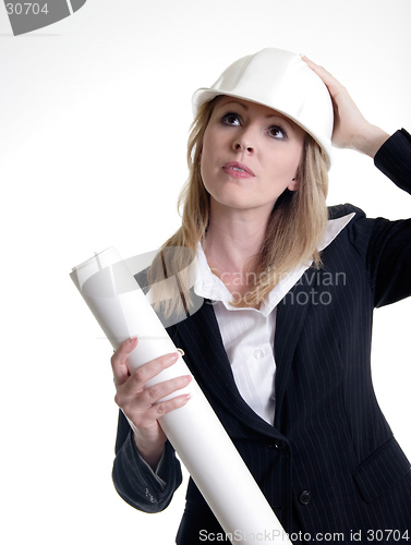 Image of Architect holding on to hard hat