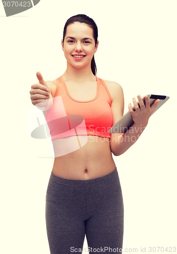 Image of sporty woman with tablet pc computer