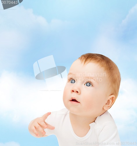 Image of curious baby looking up