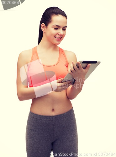 Image of sporty woman with tablet pc computer