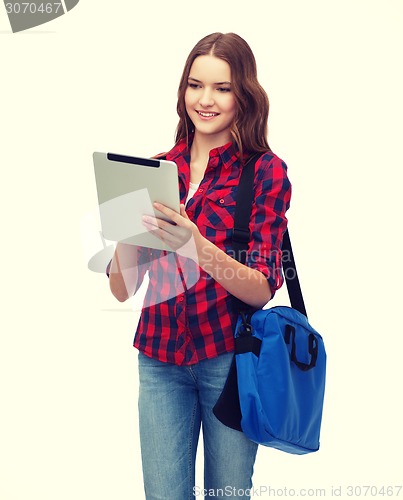 Image of smiling student with tablet pc and bag