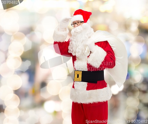 Image of man in costume of santa claus with bag