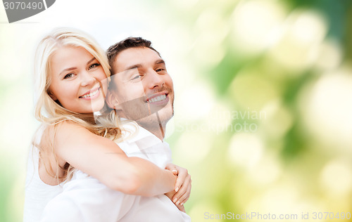 Image of happy couple having fun over poppy flowers field