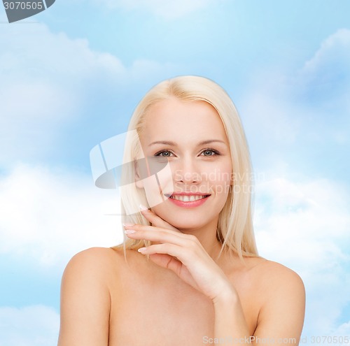 Image of face and hands of beautiful woman