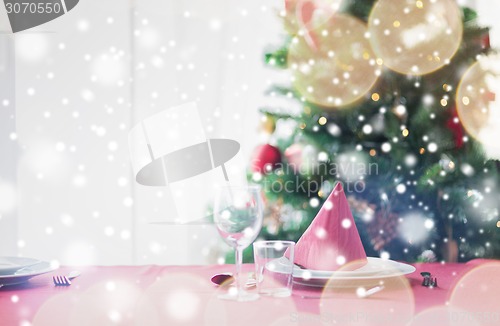 Image of room with christmas tree and decorated table