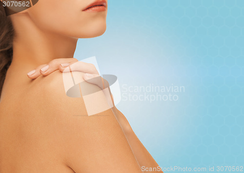 Image of beautiful young woman with bare shoulders
