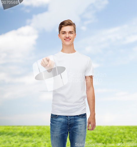 Image of smiling young man in blank white t-shirt