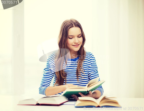 Image of happy smiling student girl with books