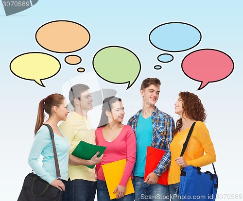 Image of group of smiling students with text bubbles