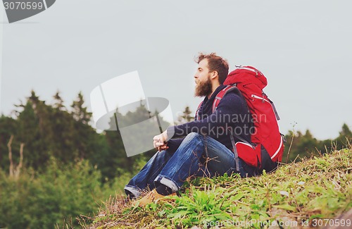 Image of man with backpack hiking